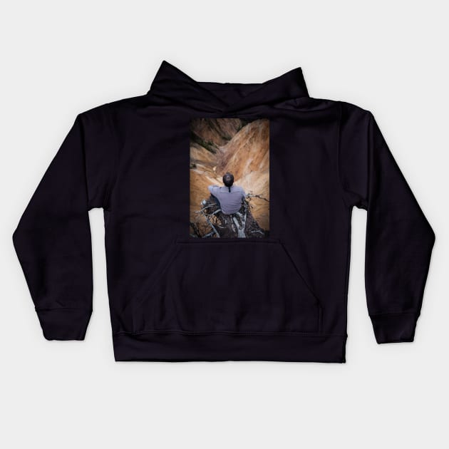 Sitting on the edge of a cliff Kids Hoodie by naturalis